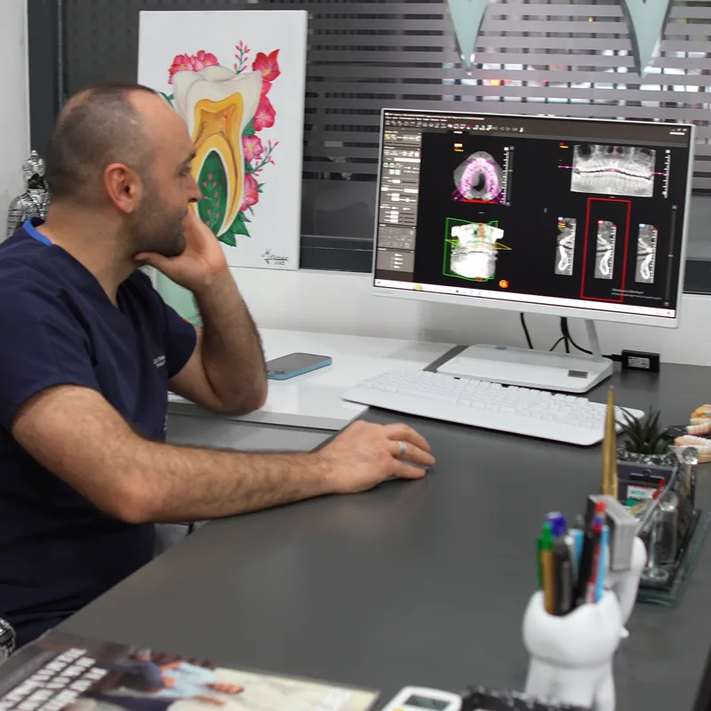 Our dentist reviewing three-dimensional X-ray data