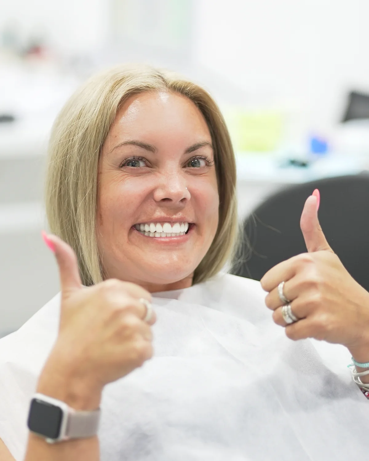 Patient giving thumbs up during treatment at Stom Dental Centre Antalya